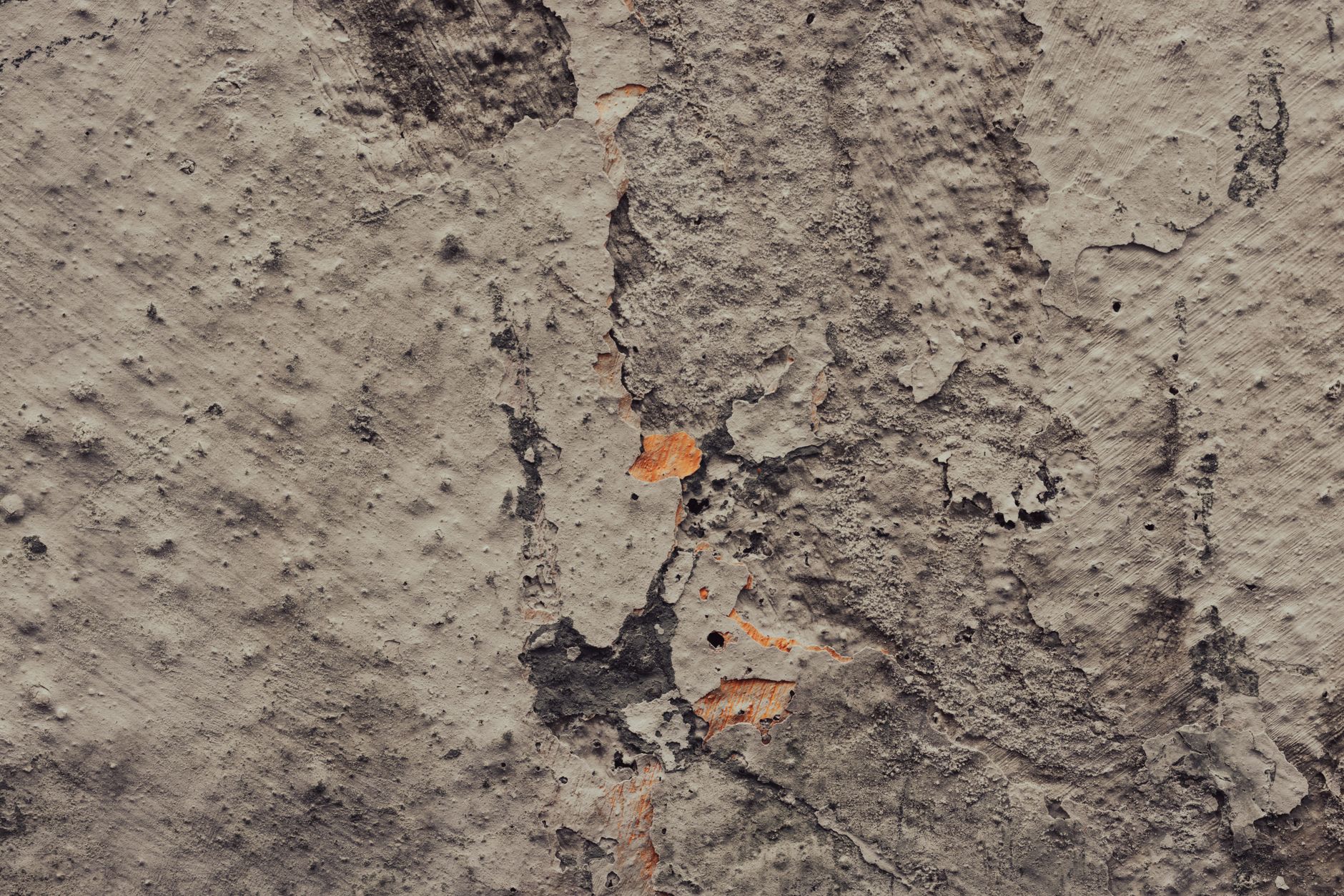 Close-up of tanking slurry applied to a basement wall as part of a Type A basement waterproofing system
