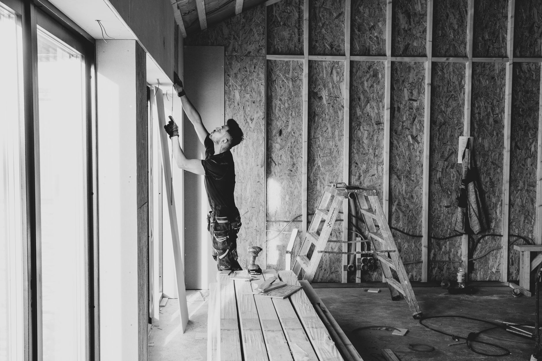 Metal stud frame being erected as part of internal partition wall systems on a UK building site